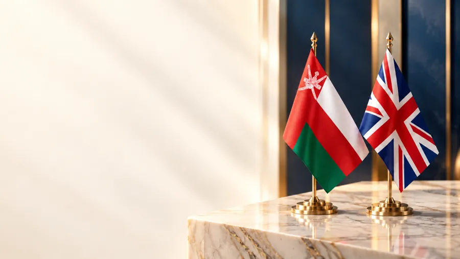 The flags of Oman and the United Kingdom side by side